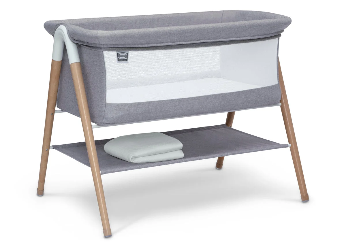 DELTA CHILDREN Koi by the Bed Bassinet With Natural Beechwood Legs